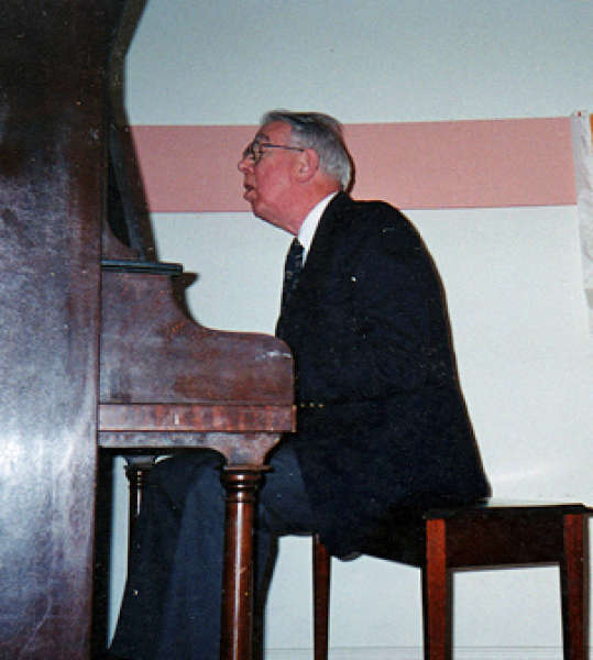 Dr, Boughen at the piano